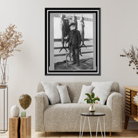 John D. Crimmins, full-length portrait, standing on pier, holding fishing rod and reel, facing front, with three saltwater fish hanging on railing, Vintage Poster