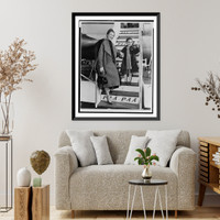 Katherine Dunham, full-length portrait, standing, facing front with her daughter Marie Christine boarding airplane in New York, Antique Print