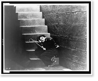 Charlie Chaplin, full-length portrait, sleeping on stairs in a scene from the movie City Lights"" Classic, Historic Reproduction