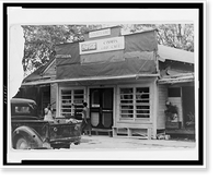 Historic Framed Print, [Two African American women and truck in front of Courts grocery store and cafe],  17-7/8" x 21-7/8"