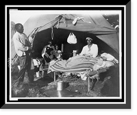 African Americans in front of tent, with one man sitting up on bed, during a Mississippi River flood, Vicksburg National Military Park, Antique Print