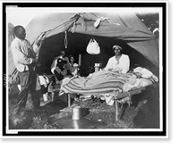 African Americans in front of tent, with one man sitting up on bed, during a Mississippi River flood, Vicksburg National Military Park, Antique Print