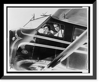 Nancy Carroll and Howard Hughes sitting in the cockpit of Mr. Hughes's plane just before taking off for Los Angeles, Historic Reproduction
