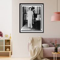 Babe Didrikson Zaharias, full-length portrait, standing, facing front, in pajamas in a Beaumont, Texas hospital following a cancer operation, Historic Print