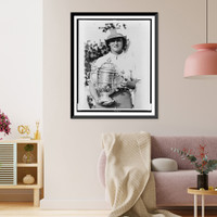 Babe Didrikson Zaharias, half-length portrait, standing, facing front, holding trophy she won in the Tam O'Shanter world" golf tournament in Chicago", Vintage Print