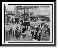Men milling around street across from the Brooklyn Navy Yard during an electrical workers strike; in background is a picket line.World-Telegram photo by Al Ravenna, Historic Reproduction