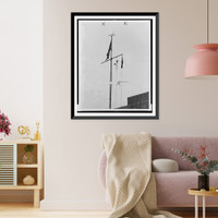 Historic Framed Print, Brooms lashed together over roof of Maritime Union Building on W 17 St.World Telegram photo by Al Aumuller.,  17-7/8" x 21-7/8"