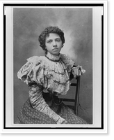 African American woman, three-quarter length portrait, seated with left arm over back of chair, facing front, Antique Wall Art