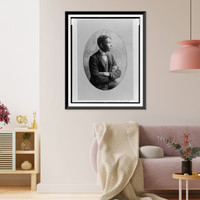 Young African American man, half-length portrait, seated with arms crossed, right profile, Antique Poster