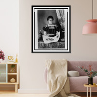 African American girl, half-length portrait, standing at table with illustrated book, facing slightly right, Antique Poster