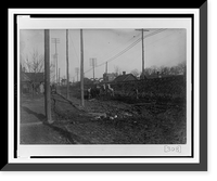 African American men, prisoners, with two mules working on roadbed(?) between electrical and telephone poles in Georgia, Antique Print