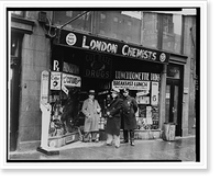 Historic Framed Print, [Two men and a New York City policeman outside the drugstore where Vincent Coll was murdered],  17-7/8" x 21-7/8"