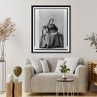 Emma Cushman, full-length portrait, seated, facing right, looking at a book in her lap, Historic Print