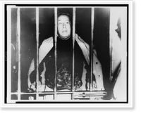 Alfaro Siqueiros, half-length portrait, facing front, peering from behind bars in a Mexico City jail Classic, Antique Print
