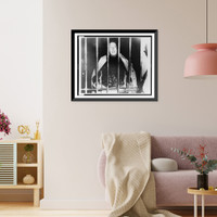 Alfaro Siqueiros, half-length portrait, facing front, peering from behind bars in a Mexico City jail Classic, Antique Print