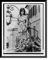Historic Framed Print, [Raquel Welch, full-length portrait, posed standing by a lantern in Rome, facing front],  17-7/8" x 21-7/8"