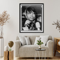 Mrs. Betty Shabazz, bust portrait, facing right, leaving Bellevue Hospital morgue after identifying the body of her slain husband, Malcolm X, New York City Classic, Vintage Poster