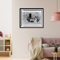 Twelve men and women gathered around a table on a patio, Vintage Wall Art