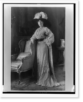 Historic Framed Print, [Evalyn Walsh McLean, full-length portrait, standing, facing front with right arm resting on back of chair],  17-7/8" x 21-7/8"
