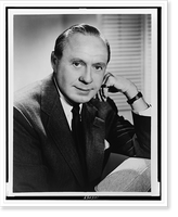 Historic Framed Print, [Jack Benny, half-length portrait, seated, facing front],  17-7/8" x 21-7/8"