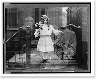 Historic Framed Print, [Double exposure spirit" photograph of girl standing,  holding flowers,  surrounded by spectral figures of three people].photograph by G.S. Smallwood,  Chicago,  Ill.",  17-7/8" x 21-7/8"