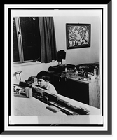 Thirteen-year-old boy playing with a model train in his bedroom, Greenbelt, Maryland, Antique Print