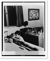Thirteen-year-old boy playing with a model train in his bedroom, Greenbelt, Maryland, Antique Print