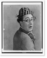 Ed Wynn, head-and-shoulders portrait, in costume as the Perfect Fool", looking over his shoulder", Vintage Print
