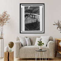 Nude boy walking along body of water near a bridge, Vintage Wall Art