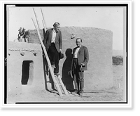 John Armstrong Chaloner (left) and Governor James G. Scrugham (right), full-length portrait, standing next to pueblo building at site of a pageant of the history of Pueblo Grande, Nevada Timeless