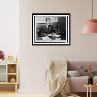 Cecil R. King, California congressman, half-length portrait, seated at desk, facing front, holding a pen, Vintage Print
