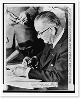 President Johnson is shown as he signed the Civil Rights bill into law during a ceremony in the East Room of the White House, Historic Print