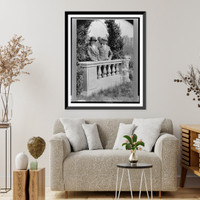 Mr. and Mrs. Joseph Medill McCormick, half-length portrait, standing behind balustrade, Vintage Print