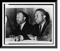 Historic Framed Print, [Dr. Martin Luther King, Jr. (l) and Ralph Abernathy, half-length portrait, seated, facing left, at press conference, Baltimore, Maryland],  17-7/8" x 21-7/8"