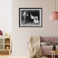 Historic Framed Print, [Norman Hapgood, Elizabeth Reynolds Hapgood, her mother, and their daughter; daughter reaching for toy bunny held by Norman Hapgood],  17-7/8" x 21-7/8"