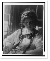 Girl with braids in white dress with bow, with hands folded, seated, Historic Print
