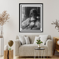Girl with braids in white dress with bow, with hands folded, seated, Historic Print