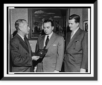 Paul M. Hahn accepts, on behalf of The American Tobacco Company, TV Guide's Gold Medal award for the television commercial of the year from Lee Wagner as A.R. Stevens looks on Timeless Wall Art P