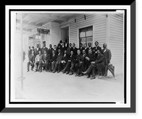 Booker T. Washington seated with group of men outside the office of Dr. W.T. White, in Palatka, Florida, Antique Print
