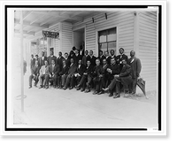 Booker T. Washington seated with group of men outside the office of Dr. W.T. White, in Palatka, Florida, Antique Print