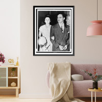 Julius and Ethel Rosenberg, half-length portrait, she facing front with her hand holding his arm, he facing left, handcuffed, Vintage Wall Art