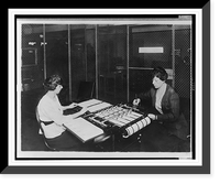 Two women using check signing machine which signs checks issued by the War Risk Bureau, Washington, D.C, Antique Poster