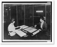 Two women using check signing machine which signs checks issued by the War Risk Bureau, Washington, D.C, Antique Poster