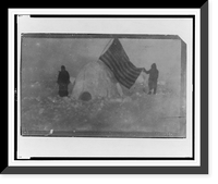 Two members of Frederick Cook's expedition, with U.S. flag stuck in igloo, at expedition camp site, North Pole, Vintage Print