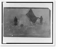 Two members of Frederick Cook's expedition, with U.S. flag stuck in igloo, at expedition camp site, North Pole, Vintage Print