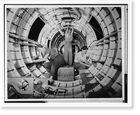 Women workers install fixtures and assemblies to a tail fuselage section of a B-17 bomber at the Douglas Aircraft Company plant, Long Beach, Calif, Historic Reproduction