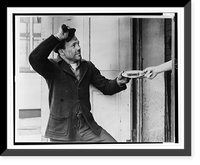 Lou Ambers tips his hat as he accepts a sandwich from a hand reaching out of a doorway.Staff photo by Alan Fisher, Antique Wall Art