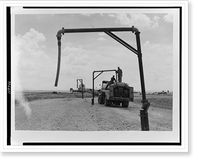 View of tank truck getting fuel from pipe to refuel airplane(?), Italy, Historic Reproduction