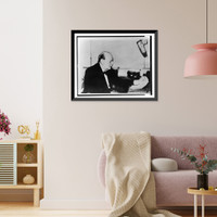 Historic Framed Print, [Sir Winston Churchill, half-length portrait, seated, facing right, making a wartime address over the radio],  17-7/8" x 21-7/8"