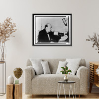 Historic Framed Print, [Sir Winston Churchill, half-length portrait, seated, facing right, making a wartime address over the radio],  17-7/8" x 21-7/8"